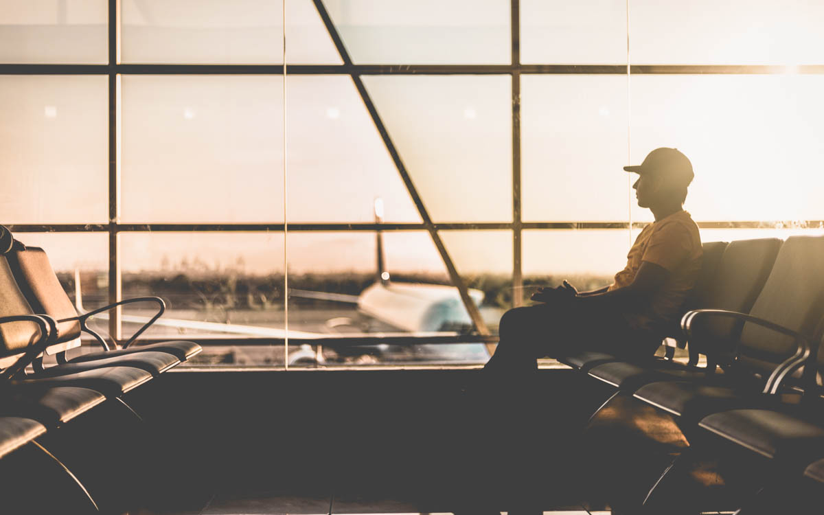 Man sitting at airport waiting for his flight