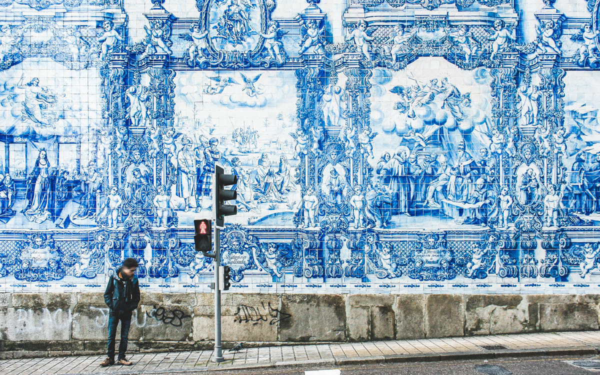 wall with azulejos, blue and white portuguese mosaic in porto portugal